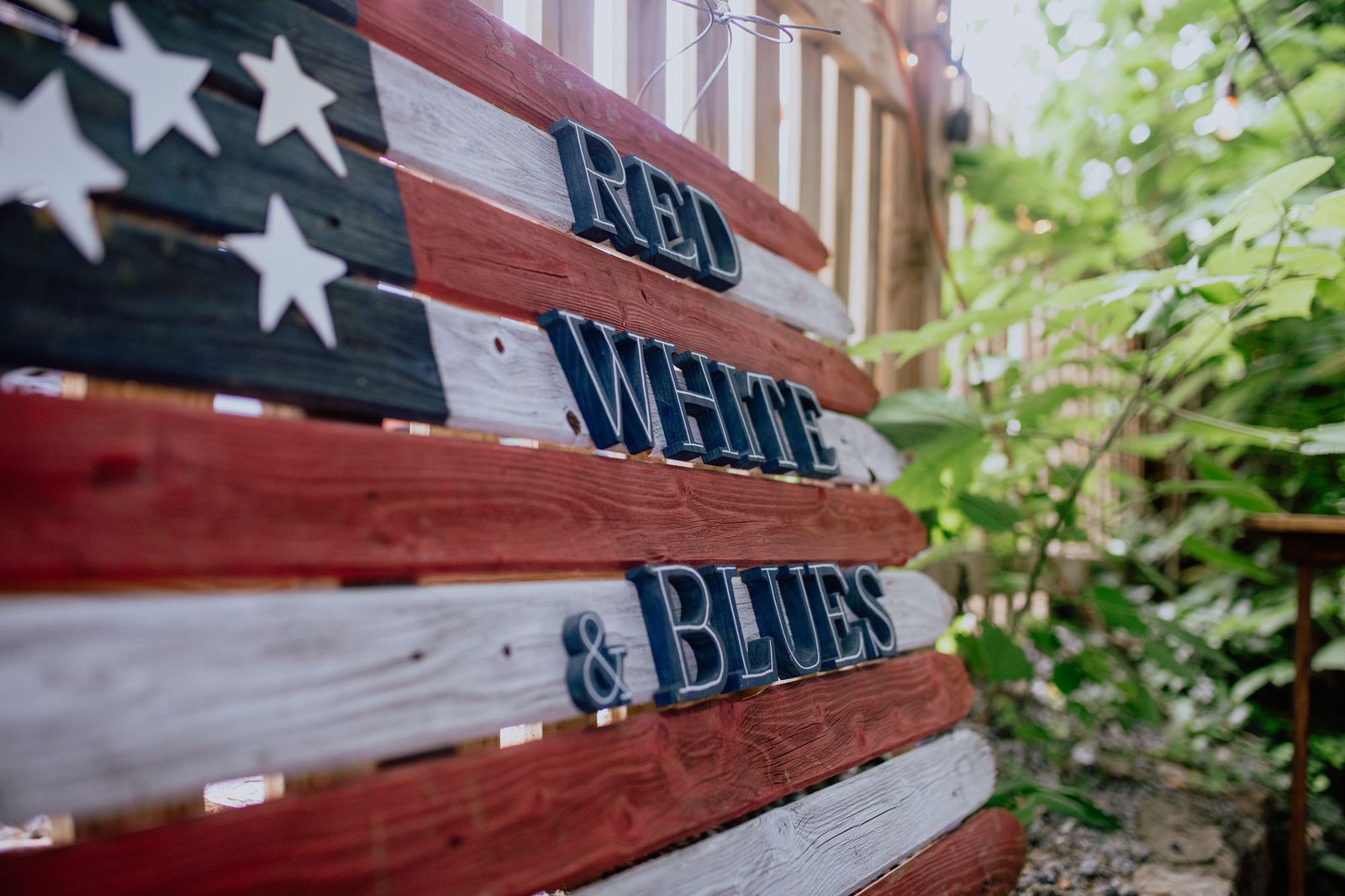 The hand-painted Red White & Blues flag sign